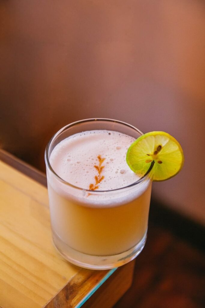 A cool and refreshing drink with lime garnish, perfect for summer evenings.